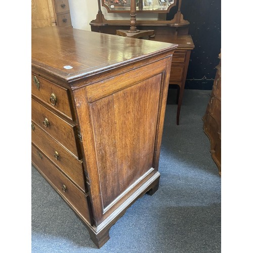 952 - An oak chest, crossbanded in mahogany, having two short and three long drawers, 98 cm wide