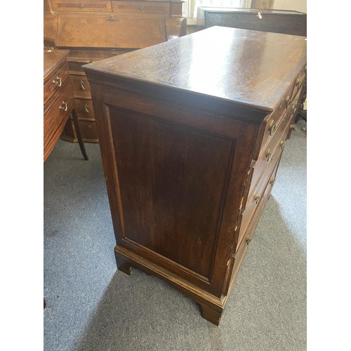 952 - An oak chest, crossbanded in mahogany, having two short and three long drawers, 98 cm wide