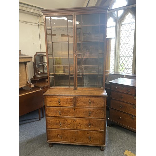 959 - A 19th century oak bookcase on chest, 212 cm high x 94 cm wide