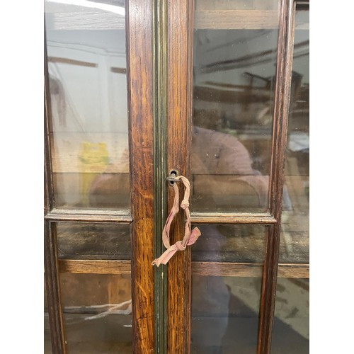 959 - A 19th century oak bookcase on chest, 212 cm high x 94 cm wide