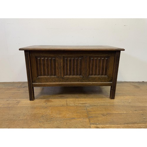 955 - A 17th century style oak coffer, 90 cm wide