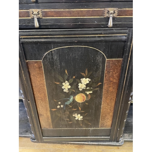 1046 - An Aesthetic Movement style ebonised sideboard, with a painted cupboard door, 125 cm wide