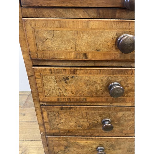 870 - A walnut chest, with a brushing slide, above four graduated drawers, 87 cm wide