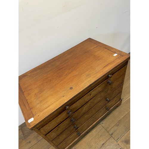 870 - A walnut chest, with a brushing slide, above four graduated drawers, 87 cm wide