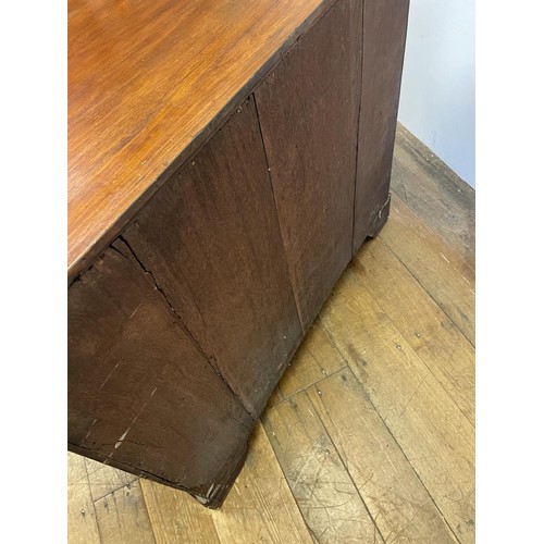 870 - A walnut chest, with a brushing slide, above four graduated drawers, 87 cm wide