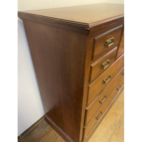 890 - An early 20th century mahogany chest, having a top hat drawer, flanked by four drawers, all above th... 