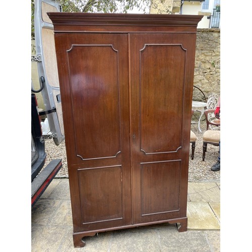 1023 - A George III style mahogany two door wardrobe, 120 cm wide