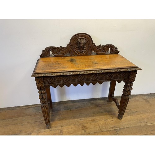 918 - A late Victorian carved oak hall table, 155 cm wide