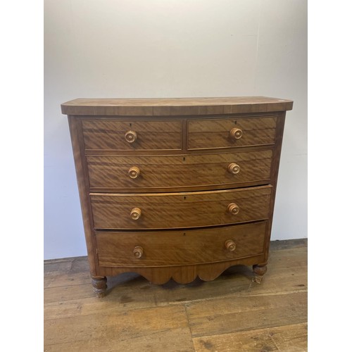 936 - A late Victorian mahogany bow front chest, having two short and three long drawers, 119 cm wide