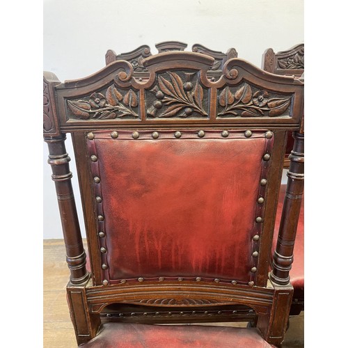 901 - A set of six late 19th century carved walnut dining chairs, with leather padded backs and seats (6)