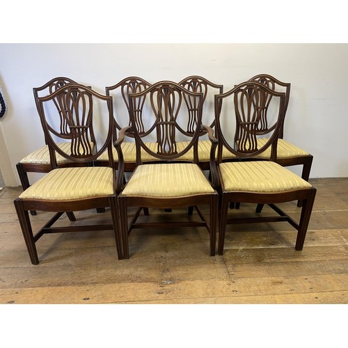 900 - A set of seven George III style mahogany shield back dining chairs (6+1)