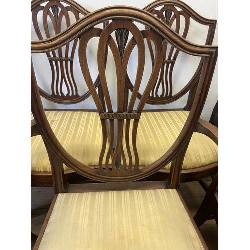 900 - A set of seven George III style mahogany shield back dining chairs (6+1)