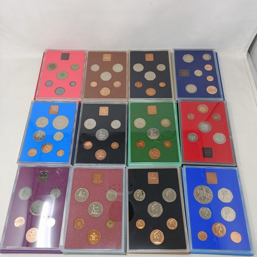 408 - A group of year proof coin sets, 1971-1983, and 1985-1986