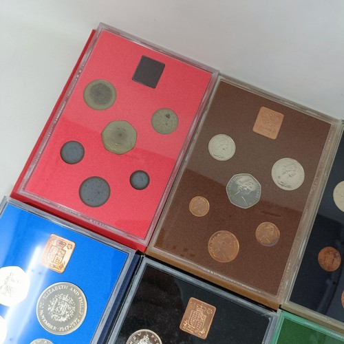 408 - A group of year proof coin sets, 1971-1983, and 1985-1986