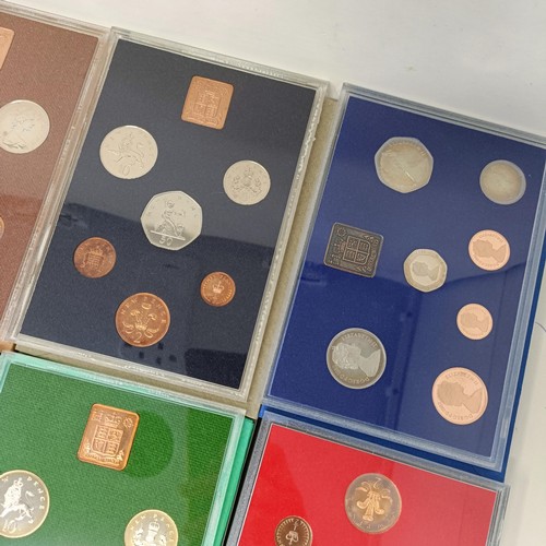 408 - A group of year proof coin sets, 1971-1983, and 1985-1986