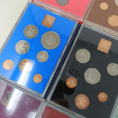 408 - A group of year proof coin sets, 1971-1983, and 1985-1986