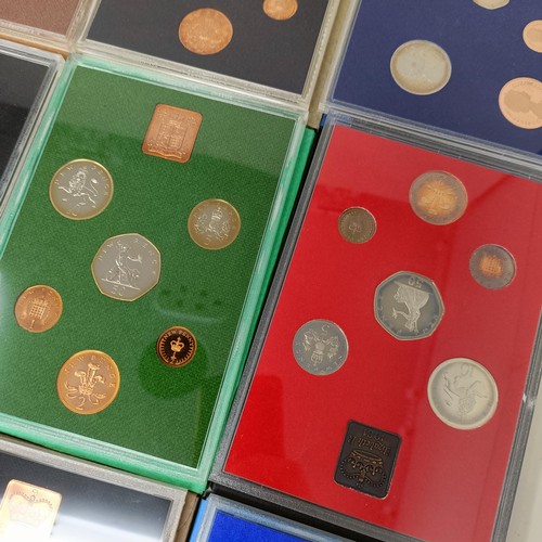 408 - A group of year proof coin sets, 1971-1983, and 1985-1986