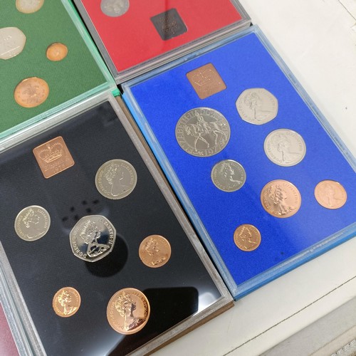 408 - A group of year proof coin sets, 1971-1983, and 1985-1986