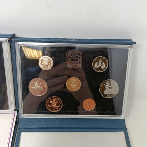 408 - A group of year proof coin sets, 1971-1983, and 1985-1986