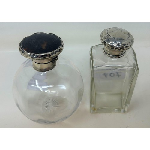 707 - A silver and tortoiseshell mounted glass scent bottle, and a silver mounted glass scent bottle (2)