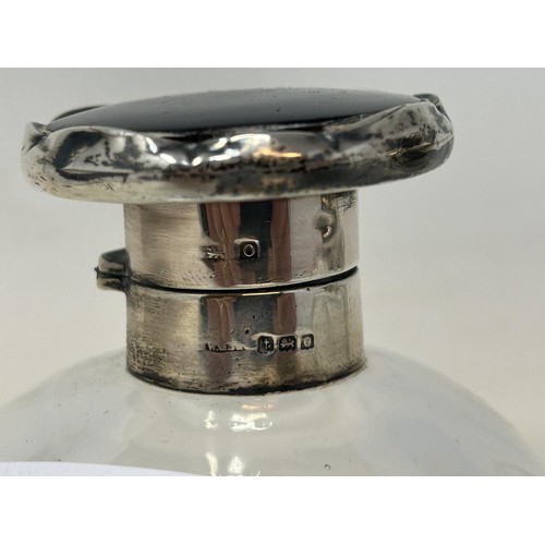 707 - A silver and tortoiseshell mounted glass scent bottle, and a silver mounted glass scent bottle (2)