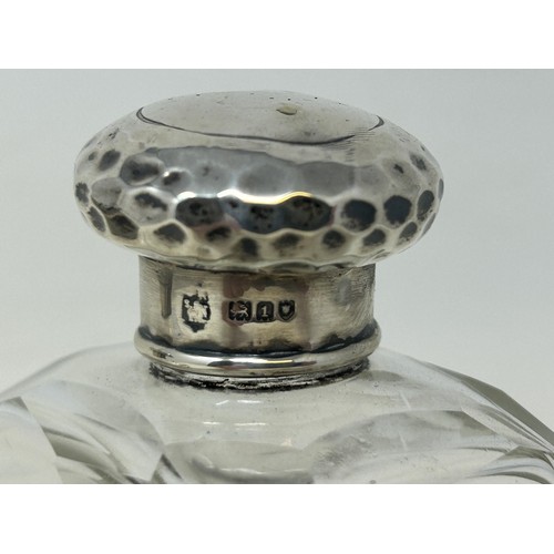 707 - A silver and tortoiseshell mounted glass scent bottle, and a silver mounted glass scent bottle (2)