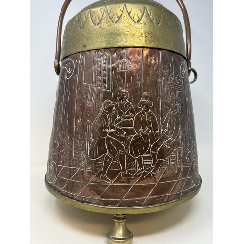 726 - A Dutch copper and brass coal box, decorated a tavern scene, 47 cm high