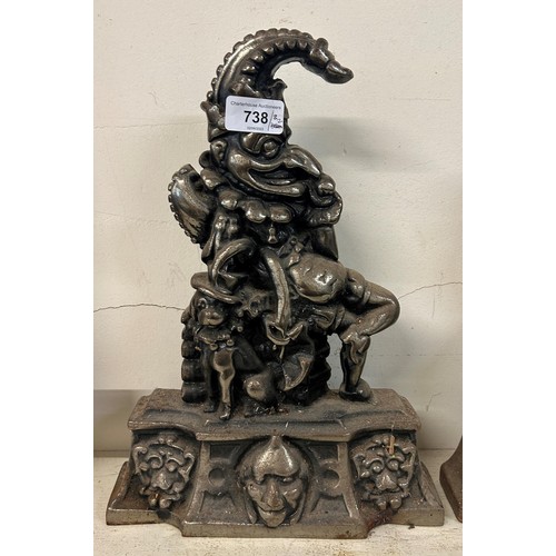 738 - A pair of metal doorstops, in the form of Mr and Mrs Punch, 36 cm high