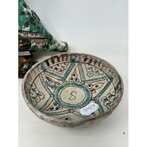 780 - A Persian bowl, 16 cm diameter, a brass insense burner, 27 cm high, and an Aquamanila (3)