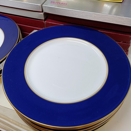 809 - A set of twelve Royal Worcester dinner plates, and a part canteen of cutlery (box)