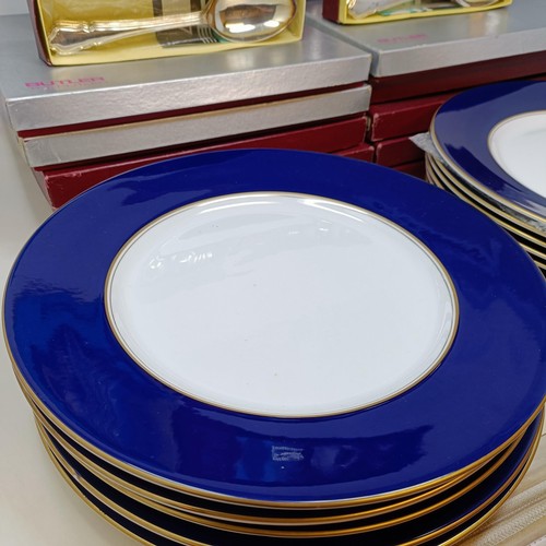 809 - A set of twelve Royal Worcester dinner plates, and a part canteen of cutlery (box)