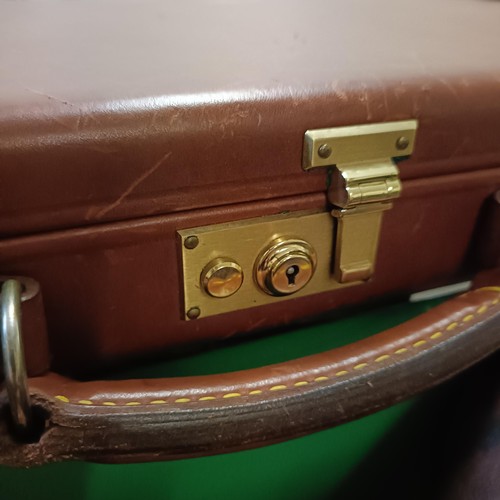 812 - A leather gun case, two other gun cases, a cartridge belt, and two cartridge bags