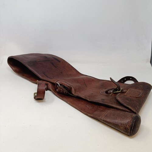 812 - A leather gun case, two other gun cases, a cartridge belt, and two cartridge bags