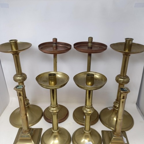 814 - A pair of large brass candlesticks, 44 cm high, and three other pairs (8)