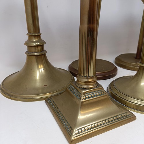 814 - A pair of large brass candlesticks, 44 cm high, and three other pairs (8)