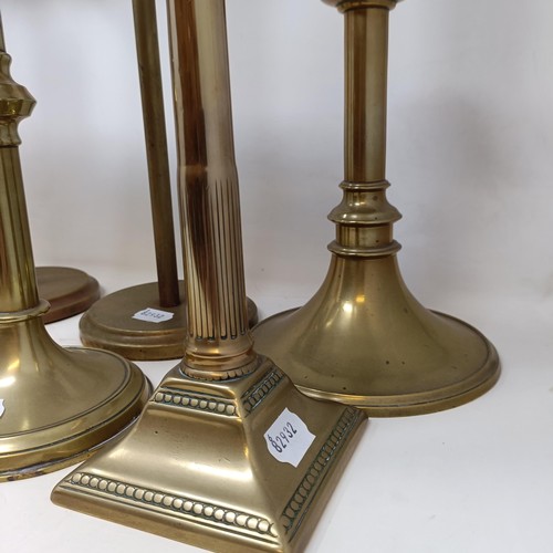 814 - A pair of large brass candlesticks, 44 cm high, and three other pairs (8)