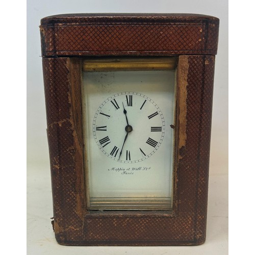 821 - A carriage clock, with an enamel dial, with Roman numerals, signed Mappin & Webb, in a brass and gla... 