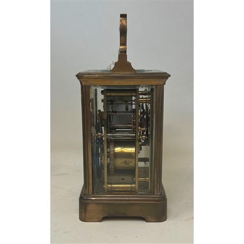 821 - A carriage clock, with an enamel dial, with Roman numerals, signed Mappin & Webb, in a brass and gla... 