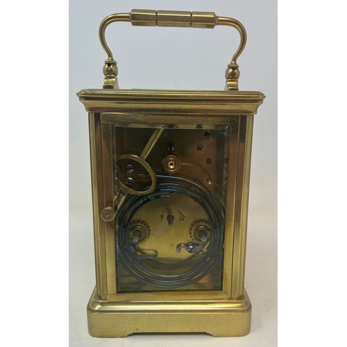 823 - A carriage clock, by G Chambers, Colchester, in a brass and glass case, 18 cm high