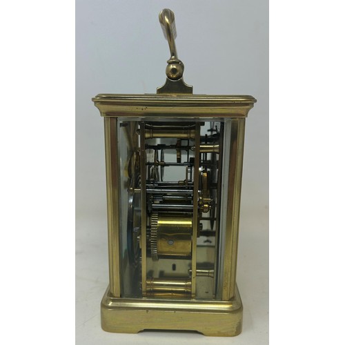 823 - A carriage clock, by G Chambers, Colchester, in a brass and glass case, 18 cm high