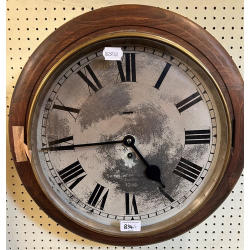 834 - A wall clock, in an oak case, 46 cm diameter, and another, 40  cm diameter (2)