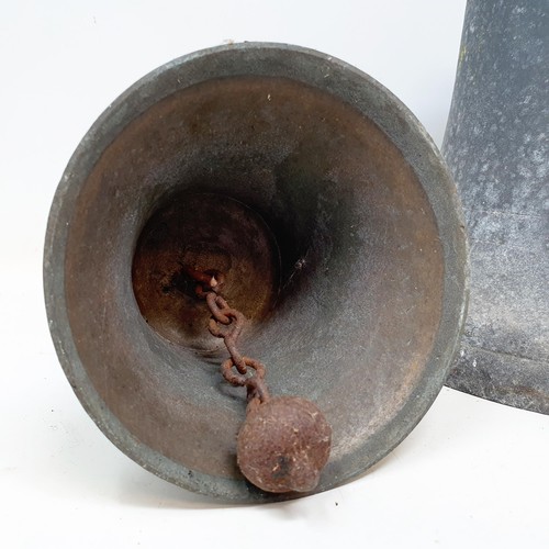 583 - A bronze ships bell, engraved, 27 cm diameter, and a school bell (2)