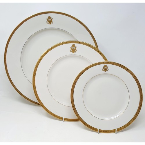 584 - Three porcelain plates, with the American Presidential crest apllied within a border of Stars and St... 