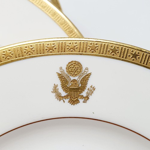 584 - Three porcelain plates, with the American Presidential crest apllied within a border of Stars and St... 