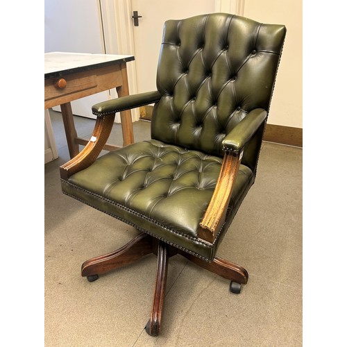 949 - A green leather office armchair