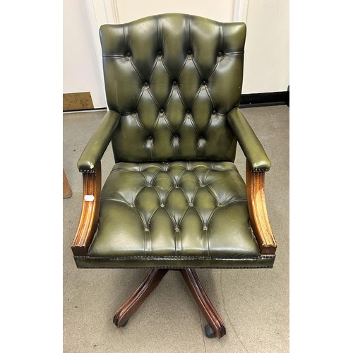 949 - A green leather office armchair