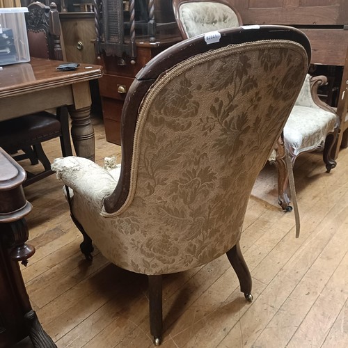 1021 - A mahogany framed button back armchair