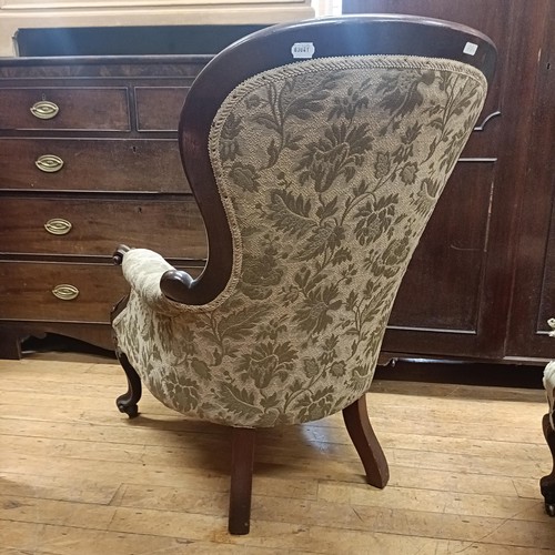 1022 - A mahogany framed button back armchair