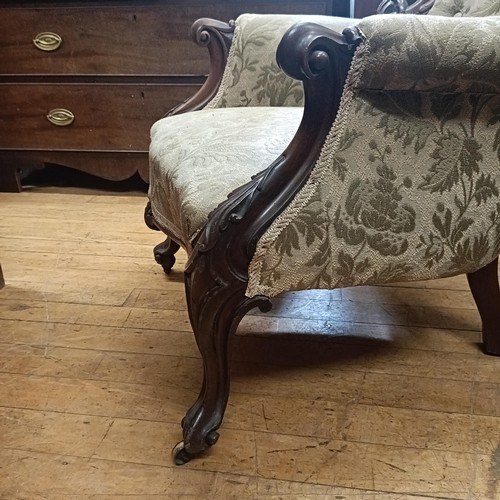 1022 - A mahogany framed button back armchair