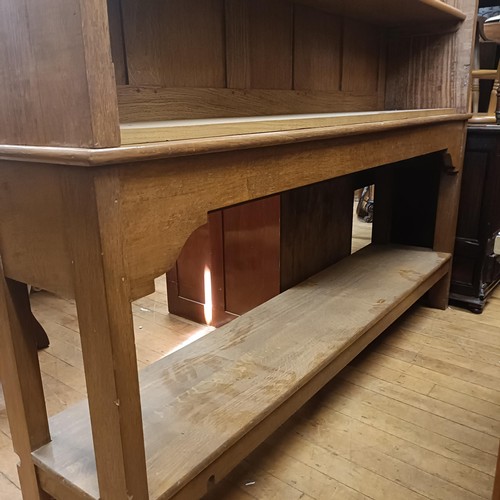 1026 - An oak glazed bookcase, on a stand, 190 cm high x 185 cm wide